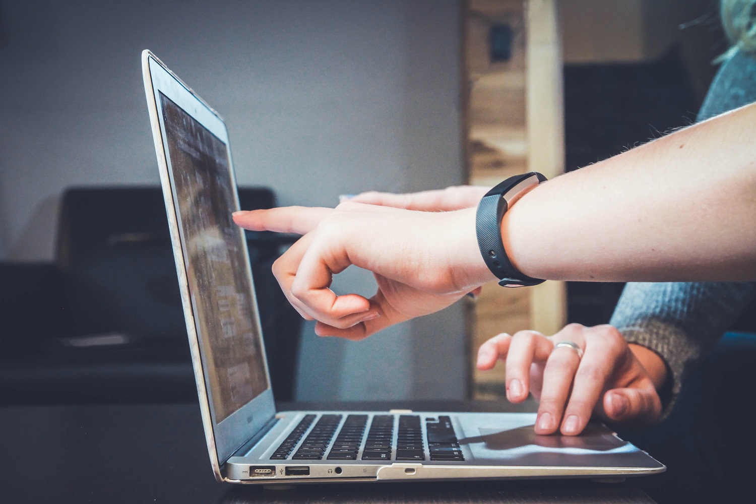 People collaborating on a computer