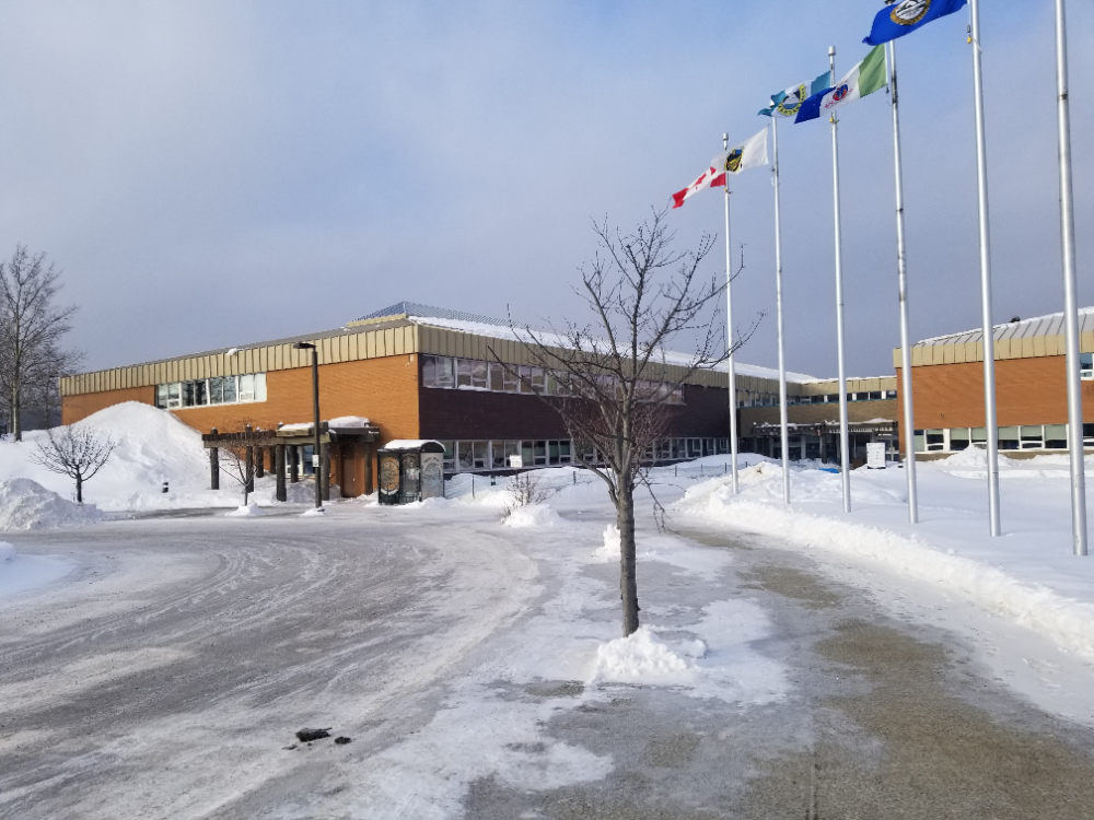 A brown building in a snowy landscape.